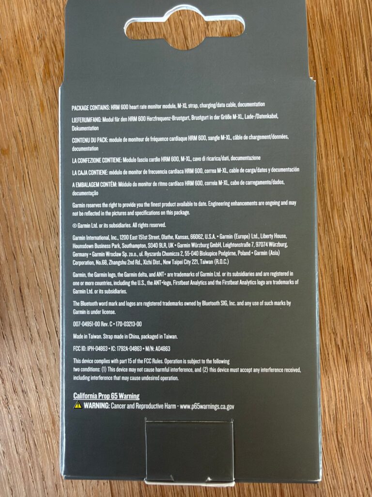 Rückseite der Garmin-HRM-600-Verpackung mit Lieferumfang in mehreren Sprachen
